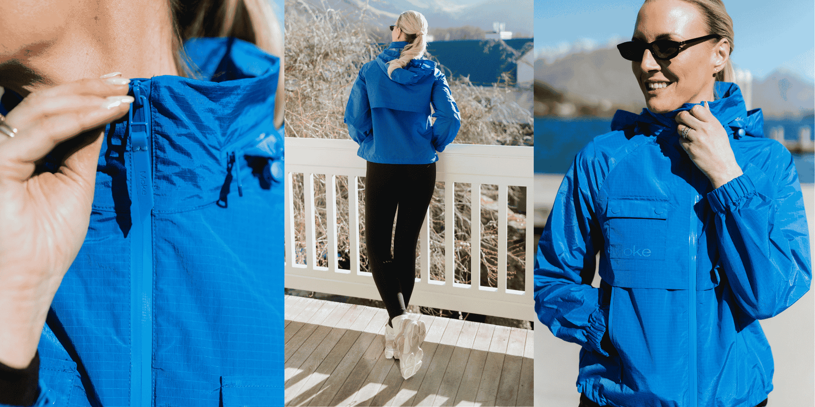 Woman wearing a blue Moke rain jacket in a coastal outdoor setting.