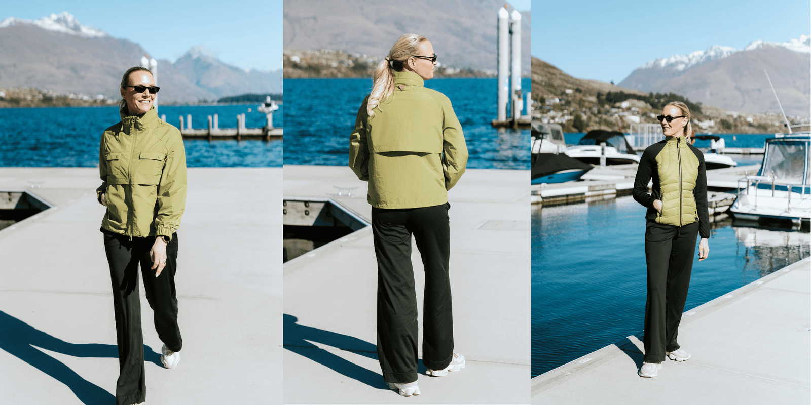 Woman wearing Moke olive green outerwear and black pants by a lake with mountains.