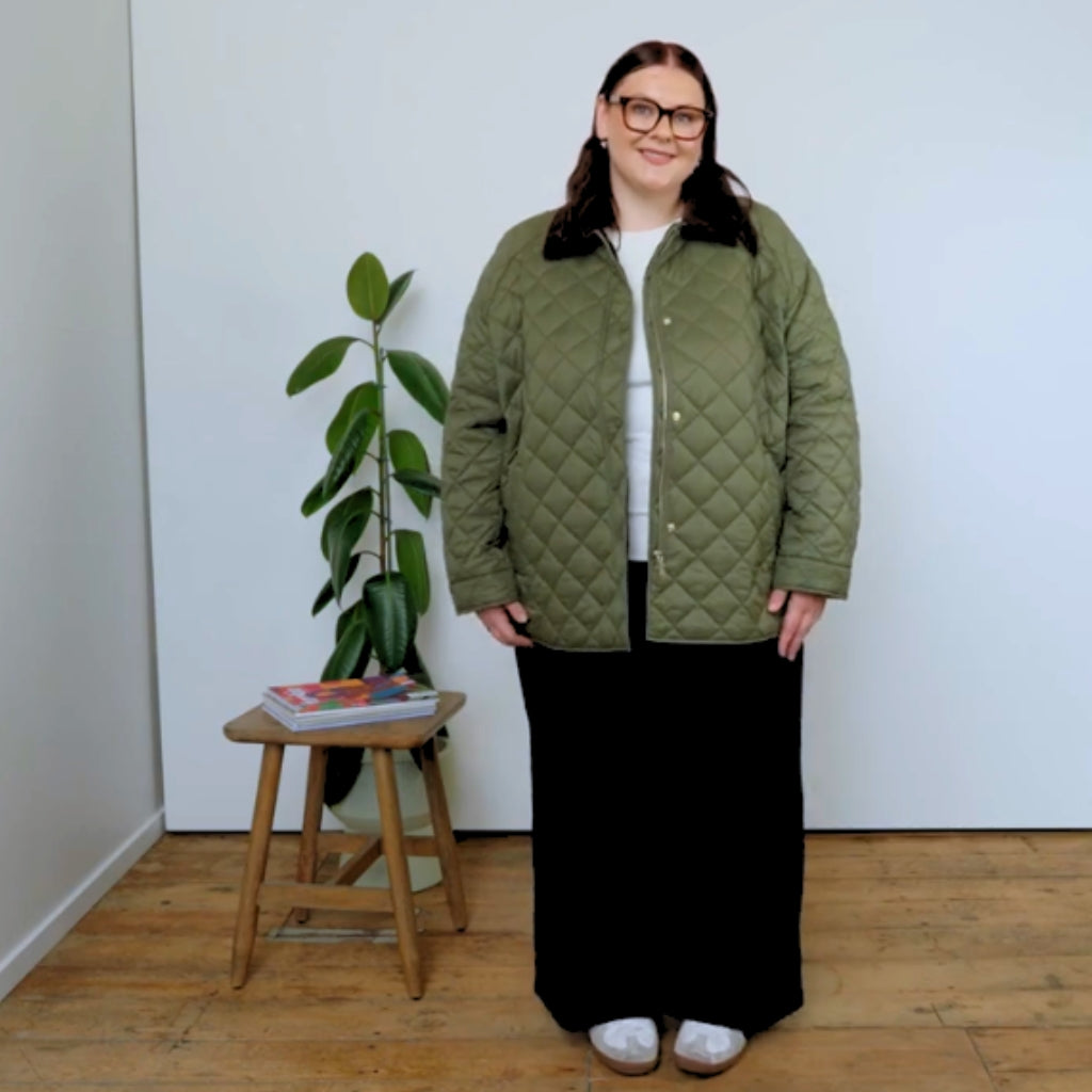 Size 3xl model in a daisy green quilted jacket