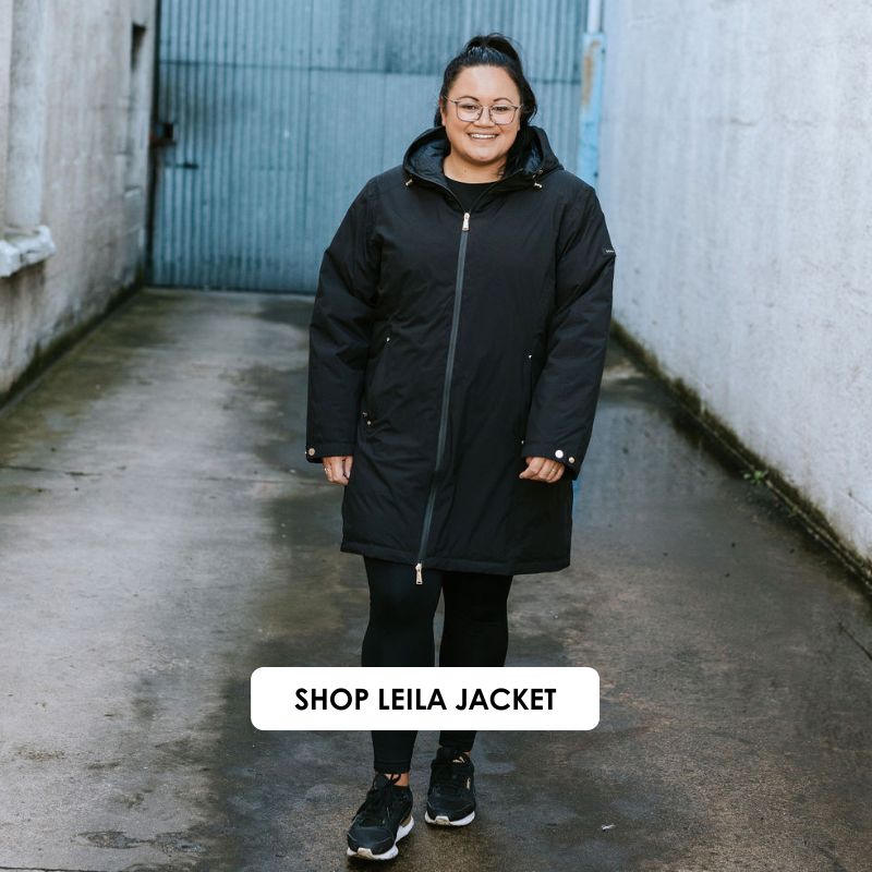 Person wearing a black jacket standing in an alleyway with 'Shop Leila Jacket' text.