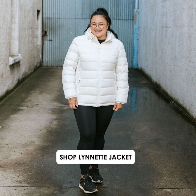 Person wearing a white puffer jacket standing in an alleyway with 'Shop Lynnette Jacket' text overlay.